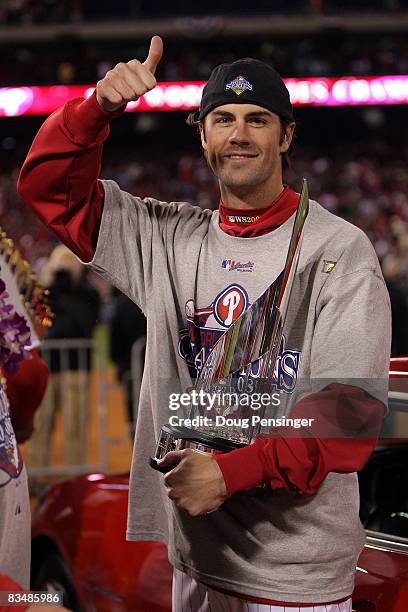 World Series MVP Cole Hamels of the Philadelphia Phillies celebrates with the MVP trophy after their 4-3 win to win the World Series against the...