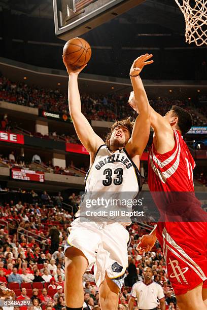 Marc Gasol of the Memphis Grizzlies shoots the ball over Yao Ming of the Houston Rockets on October 29, 2008 at the Toyota Center in Houston, Texas....