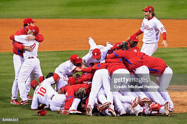 The Philadelphia Phillies pile on top of closing pitcher Brad Lidge after they won 4-3 to win the World Series against the Tampa Bay Rays during the...