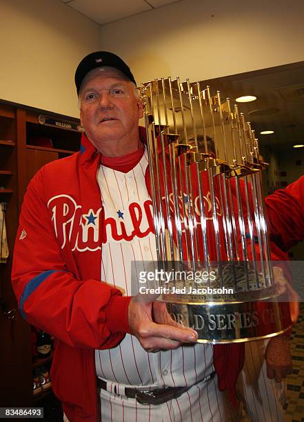 QPHILADELPHIA Manager Charloe Manuel of the Philadelphia Phillies celebrates with the World Series trophy in the locker room after their 4-3 win...