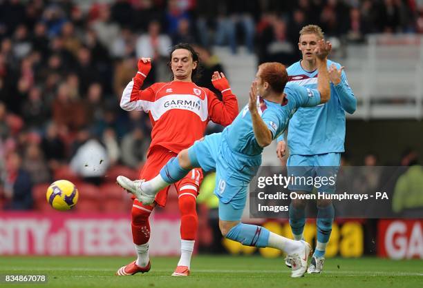 West Ham United's James Collins and Middlesbrough's Tuncay Sanli battle for the ball