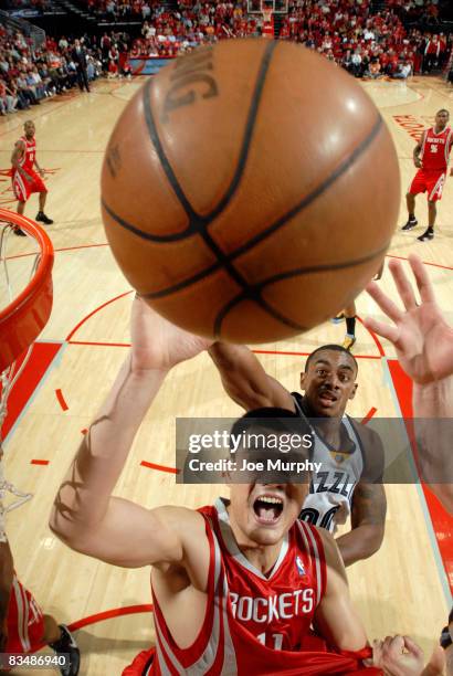 Yao Ming of the Houston Rockets fights for a rebound with Darrell Arthur of the Memphis Grizzlies on October 29, 2008 at the Toyota Center in...