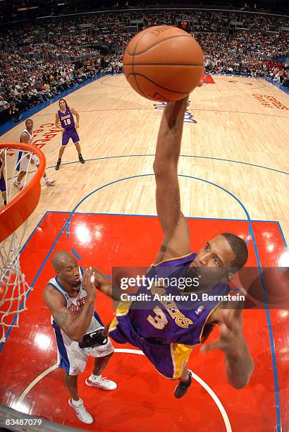 Trevor Ariza of the Los Angeles Lakers goes up for a dunk over Brian Skinner of the Los Angeles Clippers at Staples Center on October 29, 2008 in Los...