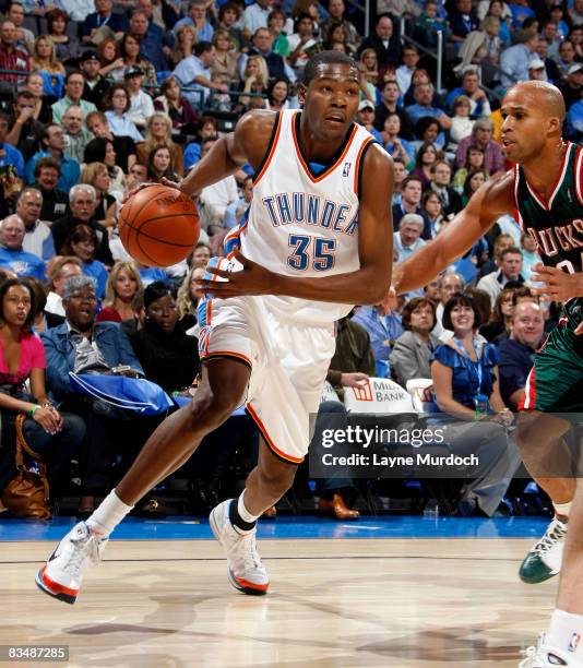 Kevin Durant of the Oklahoma City Thunder drives toward the basket while being guarded by Richard Jefferson of the Milwaukee Bucks on October 29,...