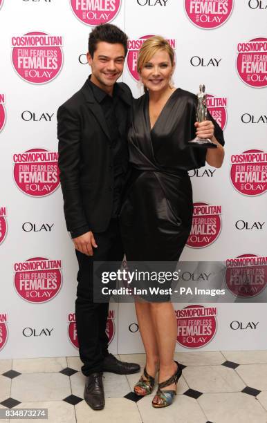 Dominic Cooper and Kim Cattrall with her Ultimate Icon Award at the Cosmopolitan Ultimate Women of the Year Awards, at Banqueting House, Whitehall...