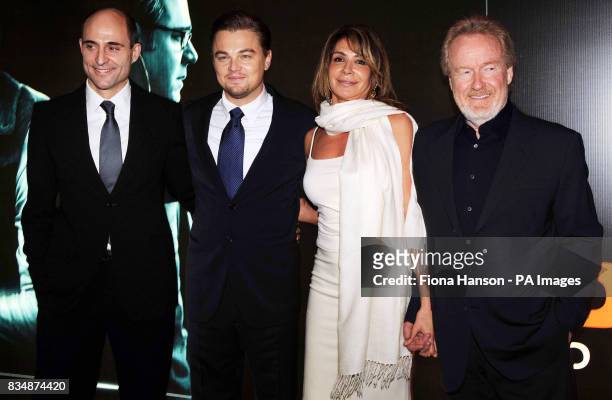 Leonardo DiCaprio, second left, with director Ridley Scott, right and his partner Giannina Facio and British actor, Mark Strong at the UK film...