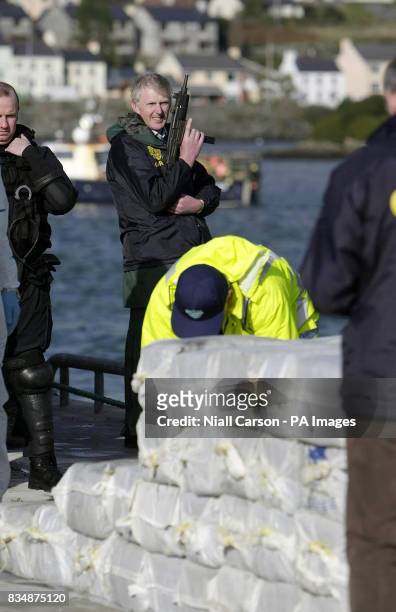 Armed Gardai officers with the half a billion euro of cocaine which was seized from a yacht off the west coast of Ireland, in the harbour at...