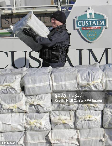 Armed Naval personnel remove the half a billion euro of cocaine which was seized from a yacht off the west coast of Ireland, in the harbour at...