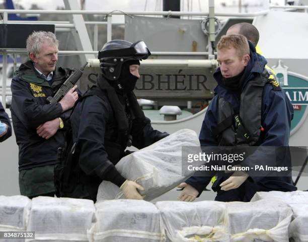 Armed Naval personnel remove the half a billion euro of cocaine which was seized from a yacht off the west coast of Ireland, in the harbour at...