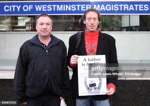 Fathers 4 Justice campaigners, Jolly Stanesby, right, and Mark Harris, arrive at City of Westminster Magistrates Court to face trial over a rooftop...