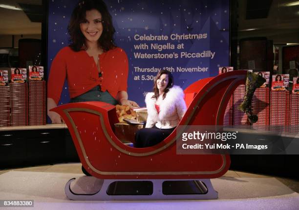 Nigella Lawson during a photocall for a signing session of her book 'Nigella Christmas: Food, Family, Friends and Festivities', at Waterstones in...
