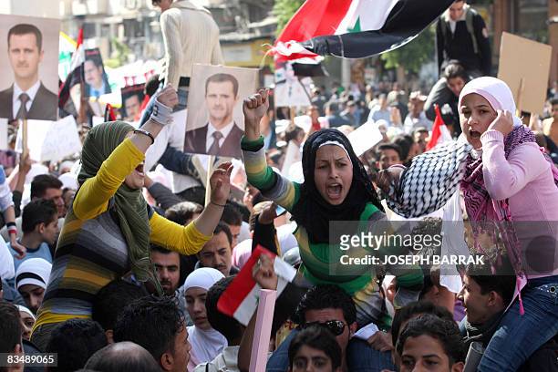 Syrian women shout slogans as they demonstrate in Damascus on October 30, 2008 to protest a deadly US raid that targeted a Syrian village near the...