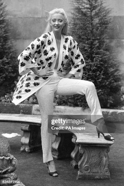 Model Christina displays legs sheathed in pure silk in a Gucci kimono trouser suit at the Ritz Casino Garden, London.