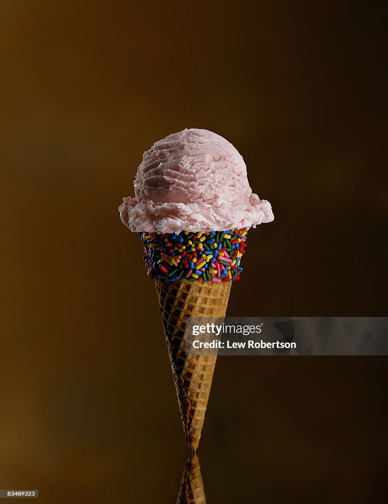 Strawberry Ice Cream cone with candy sprinkles