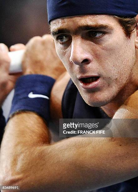 Argentina's Juan Martin Del Potro eyes the ball ad he serves to his compatriot David Nalbandian during their ATP Paris Indoor Masters tournament...