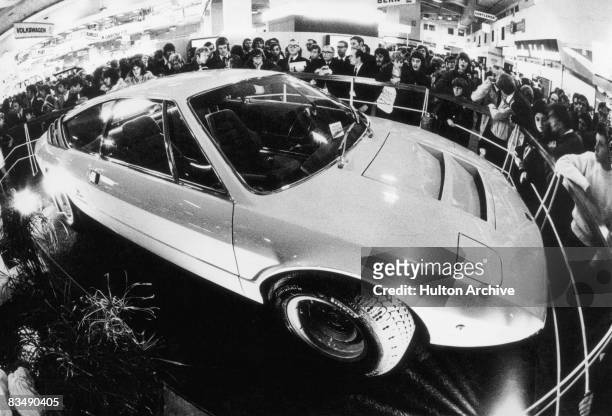 Lamborghini Urraco sports car on display at a motor show, circa 1972. Designed by Marcello Gandini of the Bertone design studio, the four-seater was...