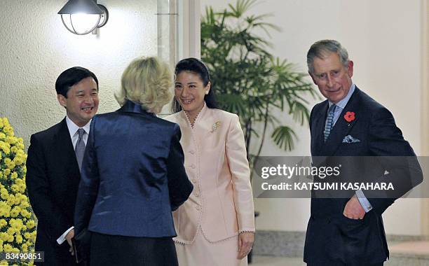 Britain's Prince Charles looks on as Japan' Crown Princess Masako greets his wife Camilla , the Duchess of Cornwall while Crown Prince Naruhito...