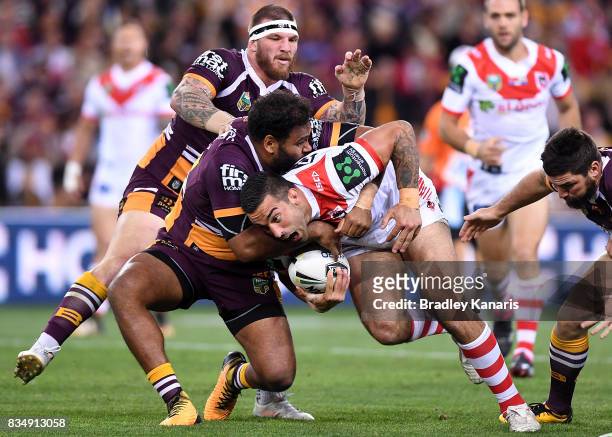 Paul Vaughan of the Dragons takes on the defence during the round 24 NRL match between the Brisbane Broncos and the St George Illawarra Dragons at...