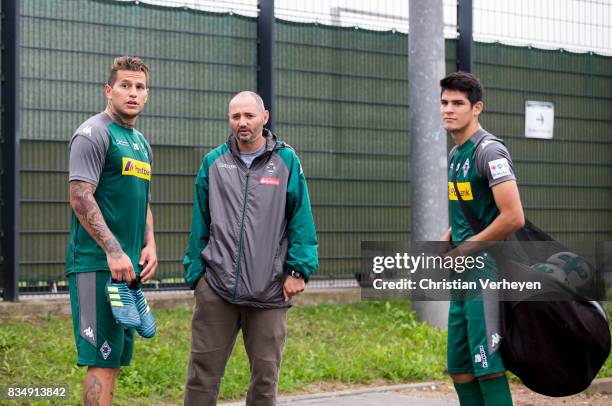 Raul Bobadilla talks to Oliver Neuville and Julio Villalba during the training session of Borussia Moenchengladbach at Borussia-Park on August 18,...