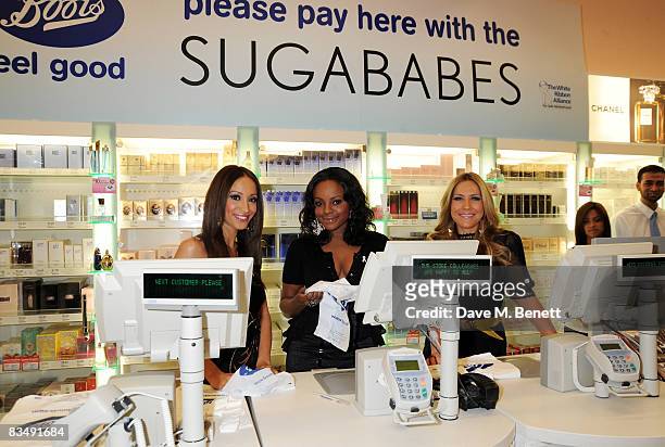 Amelle Berrabah, Keisha Buchanan and Heidi Range of Sugababes pose to launch the new Boots store in the Westfield Shopping Mall, on October 30, 2008...