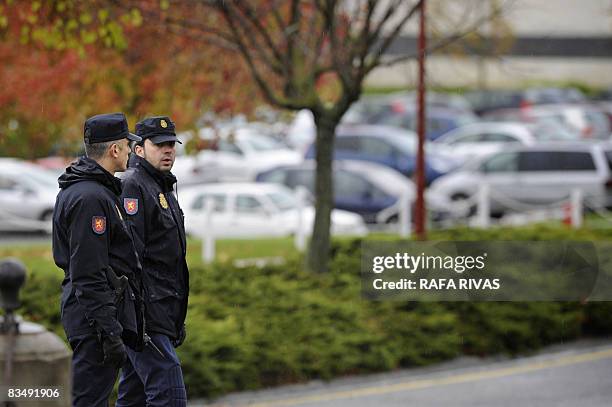 Police secure the area after a car bomb exploded in the University of Navarra campus parking lot on October 30, 2008 in Pamplona. A car bomb exploded...