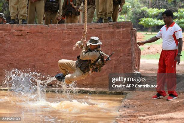 Indian trainee recruits undergo physical endurance training at the Parachute Regiment Training Centre in Bangalore on August 18, 2017. Para is a...