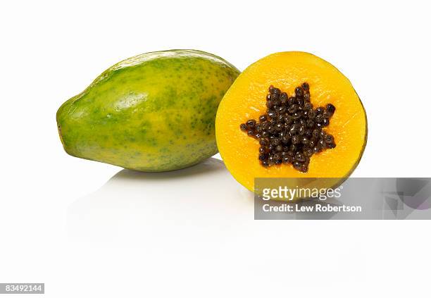 papaya on white - papaia foto e immagini stock