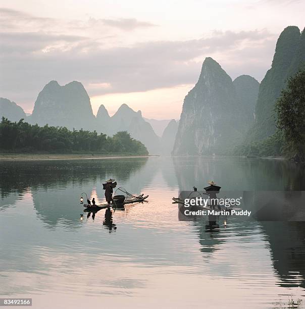 fishermen on the li river - guilin stock pictures, royalty-free photos & images