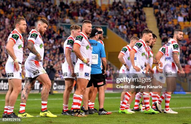 Dragons players look dejected during the round 24 NRL match between the Brisbane Broncos and the St George Illawarra Dragons at Suncorp Stadium on...