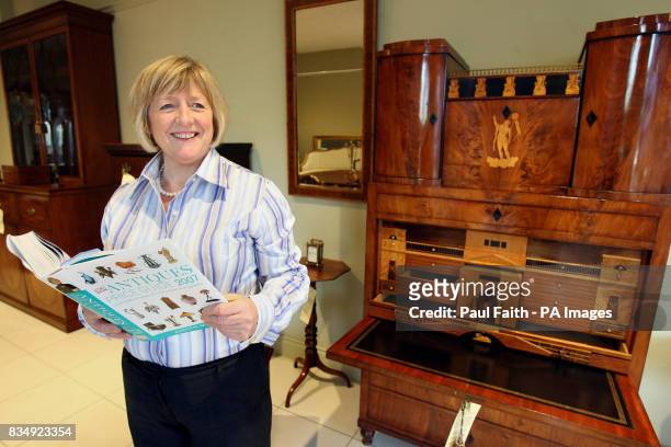 Sharon Hamilton, inside her shop the 'Antique Gallery' on the Lisburn Road in Belfast, with her 19th Century mahogany desk from Italy vauled at...