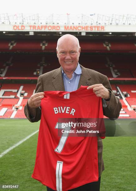 Jean-Claude Biver, CEO of Hublot Watches, poses with a Manchester United shirt after a press conference to announce Hublot Watches as the official...