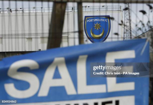 Sign advertises a car boot sale at Portsmouth FC's Fratton Park ground is pictured near a domestic property's For Sale sign in Frogmore Road after it...