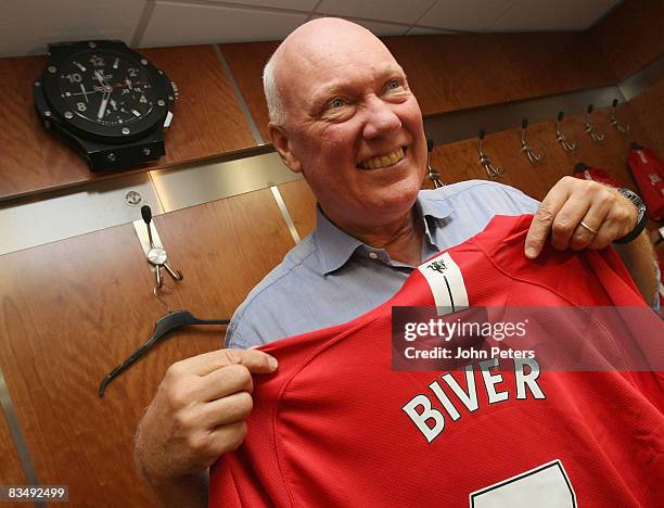 Jean-Claude Biver, CEO of Hublot Watches, poses with a Manchester United shirt after a press conference to announce Hublot Watches as the official...