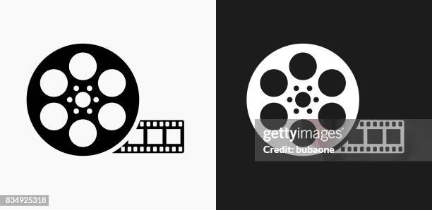 movie reel icon on black and white vector backgrounds - get out film 2017 stock illustrations