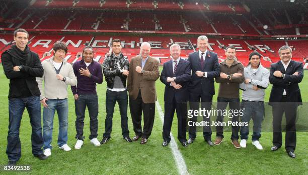 Rio Ferdinand, Ji-Sung Park, Anderson, Cristiano Ronaldo, Sir Alex Ferguson, David Gill, Ryan Giggs and Carlos Tevez of Manchester United pose with...