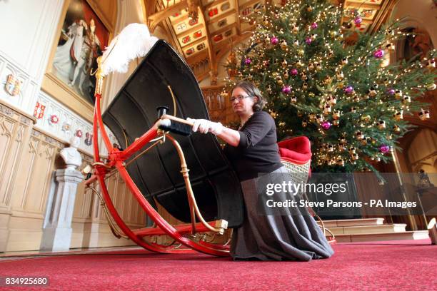 Curator at the Royal Collection Kathryn Jones, carries out final checks on Queen Victoria's Sleigh which is to go on display for the first at Windsor...