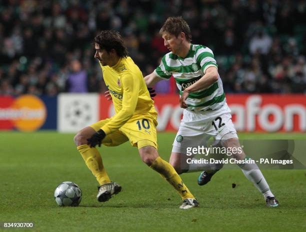 Villarreal's Cani holds off Celtic's Mark Wilson during the UEFA Champions League match at Celtic Park, Scotland.