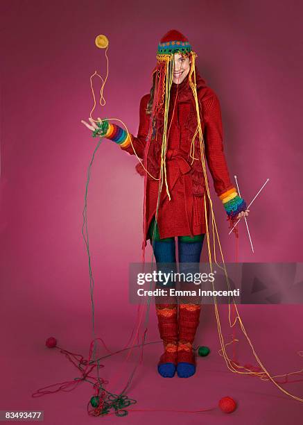 portrait of a lady wearing her knitted garments - pink sock stockfoto's en -beelden