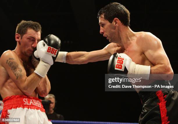 Manchester's Stephen Bell in action with Birmingham's Shaun Walton during the Super Featherweight Contest at the Kingsway Sports Centre, Widnes.