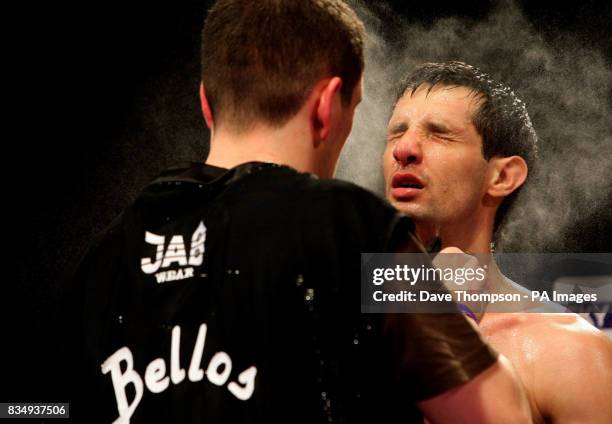 Manchester's Stephen Bell is sprayed with water during the Super Featherweight Contest against Birmingham's Shaun Walton at the Kingsway Sports...