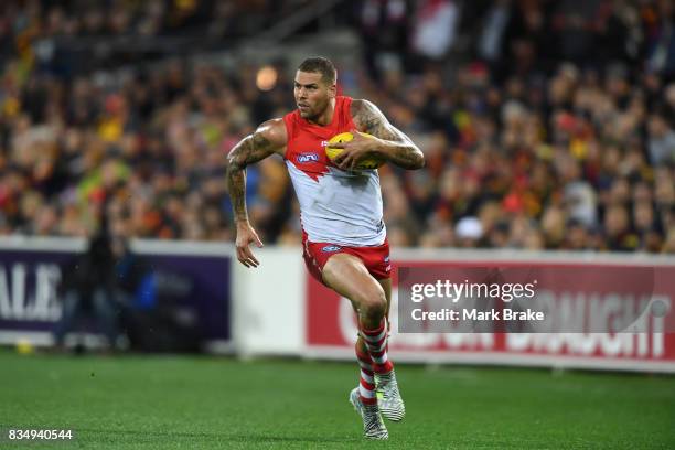 Buddy Franklin of the Swans runs the wing from the halfway mark and scores a goal during the round 22 AFL match between the Adelaide Crows and the...