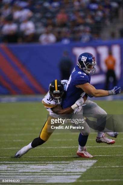 Safety Jordan Dangerfield of the Pittsburgh Steelers makes a stop against the New York Giants during an NFL preseason game at MetLife Stadium on...