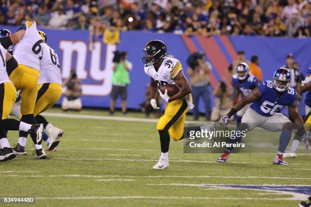 Running Back Terrell Watson of the Pittsburgh Steelers has a long gain against the New York Giants during an NFL preseason game at MetLife Stadium on...