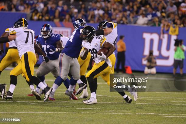 Running Back Terrell Watson of the Pittsburgh Steelers has a long gain against the New York Giants during an NFL preseason game at MetLife Stadium on...
