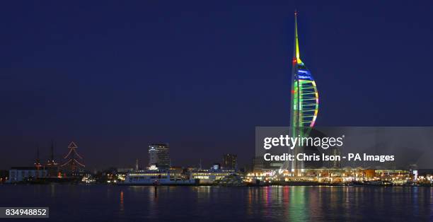 Two huge Christmas 'trees' light up Portsmouth Harbour in Hampshire, as the lights of the Spinnaker Tower have been reset to give it a green trunk...