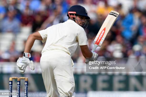 England's Alastair Cook takes a single during play on day 2 of the first Test cricket match between England and the West Indies at Edgbaston in...