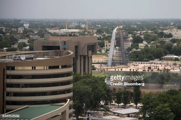 The offices of the Caisse Nationale des Prevoyances Sociales, left, the Central Bank of Central African States, center, and the Arch of the Place de...