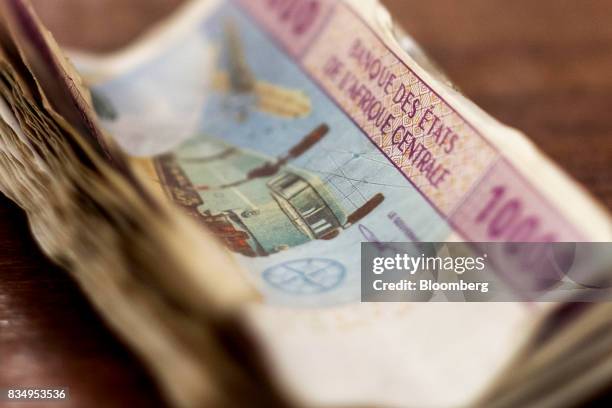 Bundle of 10,000 denomination Central African franc banknotes sit in this arranged photograph in N'Djamena, Chad, on Wednesday, Aug. 16, 2017....