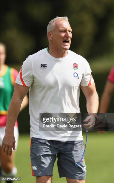 Simon Middleton, the England head coach looks on during the Women's Rugby World Cup Pool B match between England and USA at Billings Park UCB during...