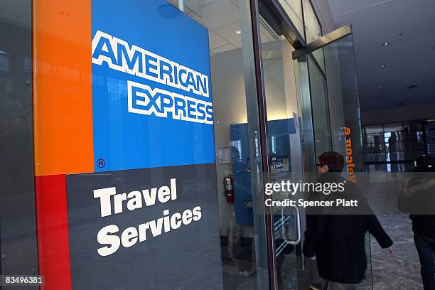 Woman walks into an American Express travel agency inside the American Express headquarters October 30, 2008 in New York City. American Express, a...